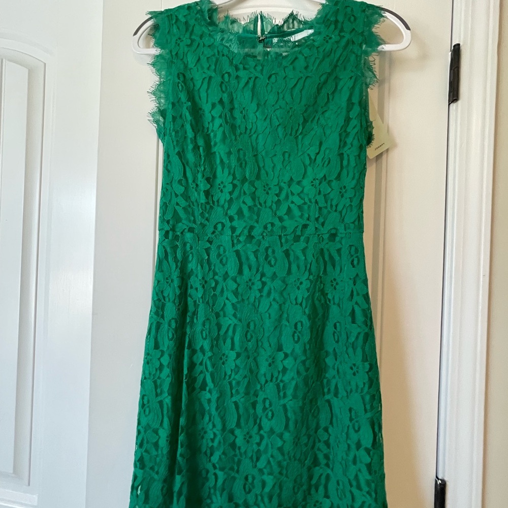 New, never worn green lace dress with bow details in the back.